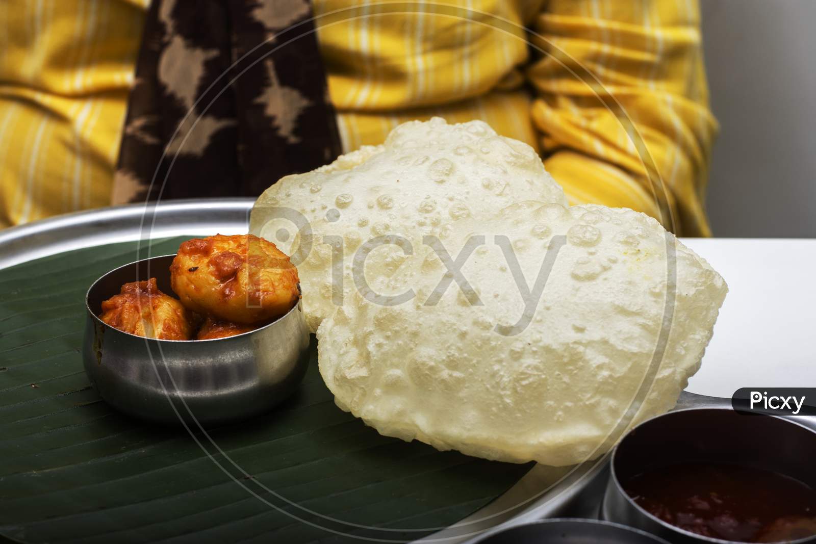 Delicious Bengali Bread Called Luchi Served With Potato Curry Called Aloo Dum . Selective Focus.