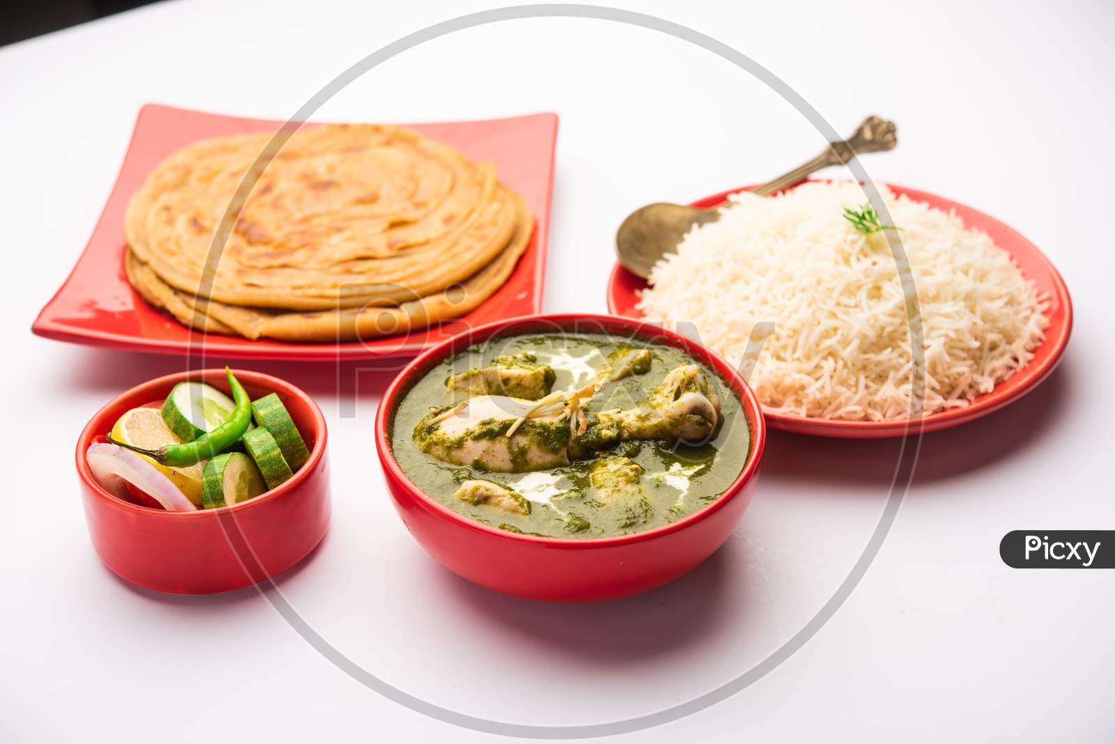 Green Palak Chicken Curry Or Murgh Hariyali Tikka Masala Or Spinach Murg Saagwala Served With Rice And Laccha Paratha