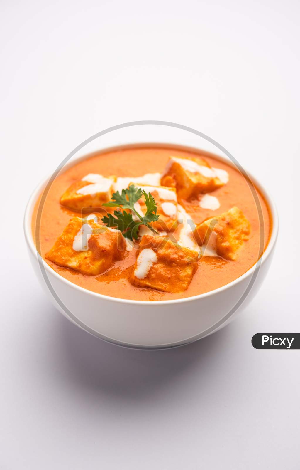 Paneer Butter Masala Or Cheese Cottage Curry Served With Rice And Laccha Paratha
