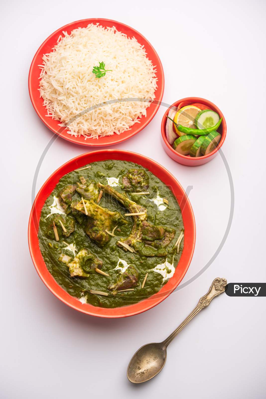Palak Gosht Or Mutton Curry, Indian Style Spinach And Lamb Curry Served With Rice And Laccha Paratha