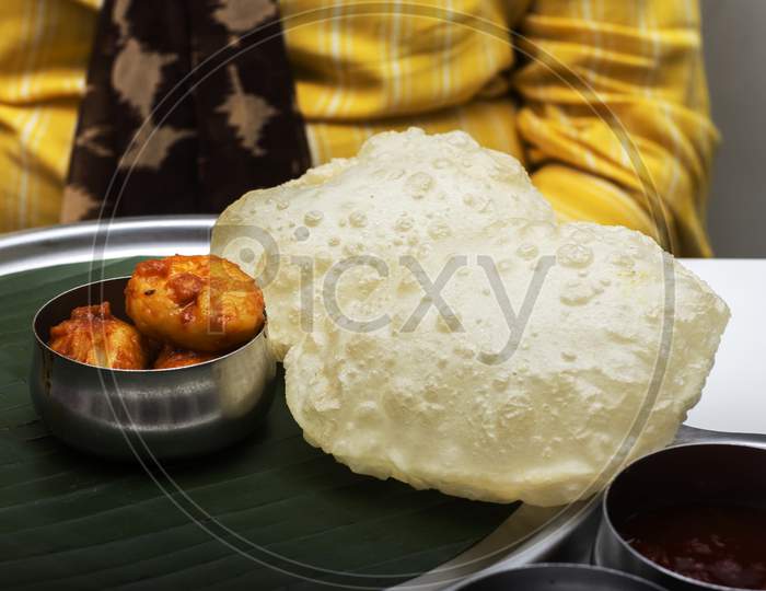 Delicious Bengali Bread Called Luchi Served With Potato Curry Called Aloo Dum . Selective Focus.