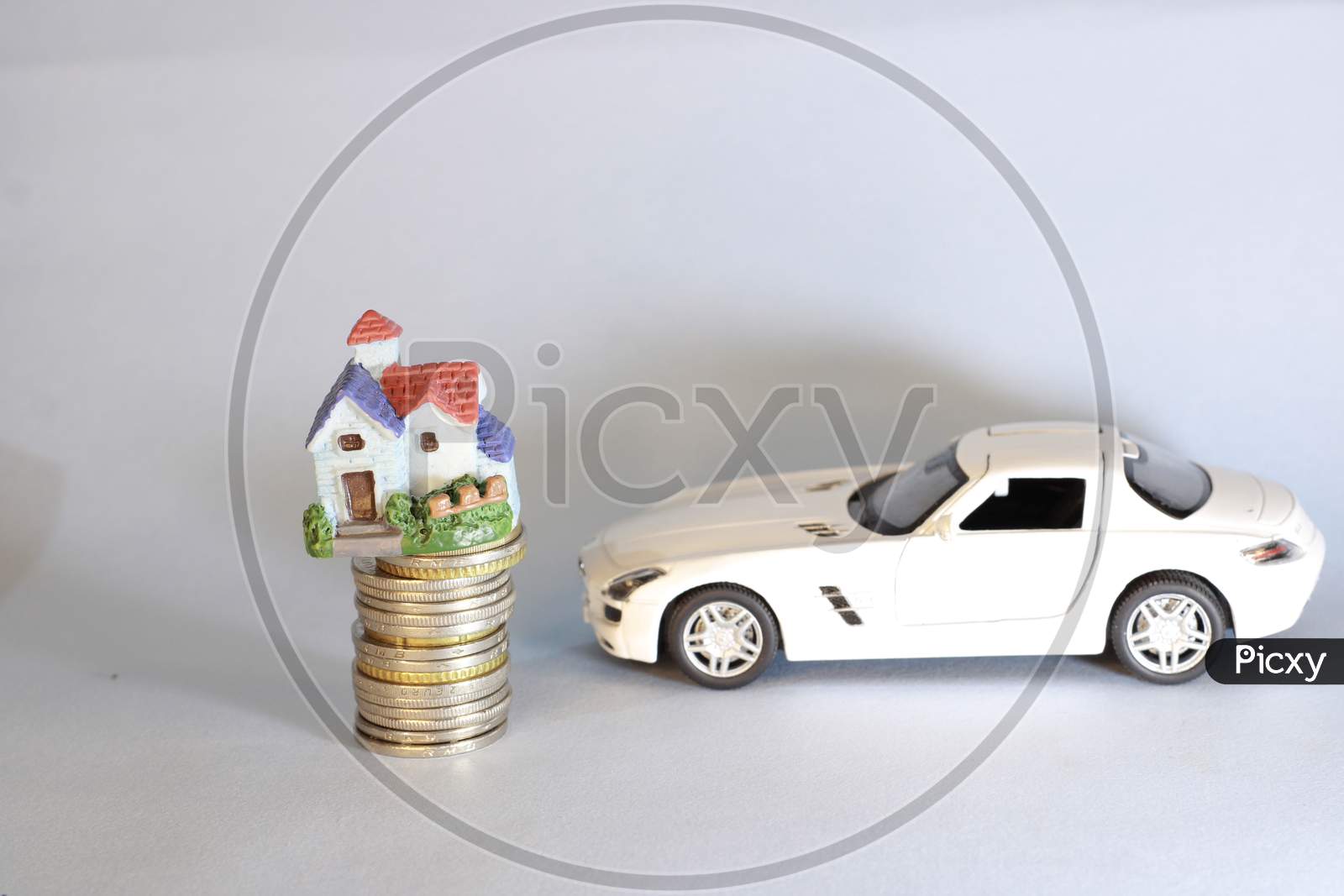 house model on money coins concept for savings, investment,  mortgage fund finance and home loan refinance. Real estate or property development. Bank loan or finance for home, Car loan financing.