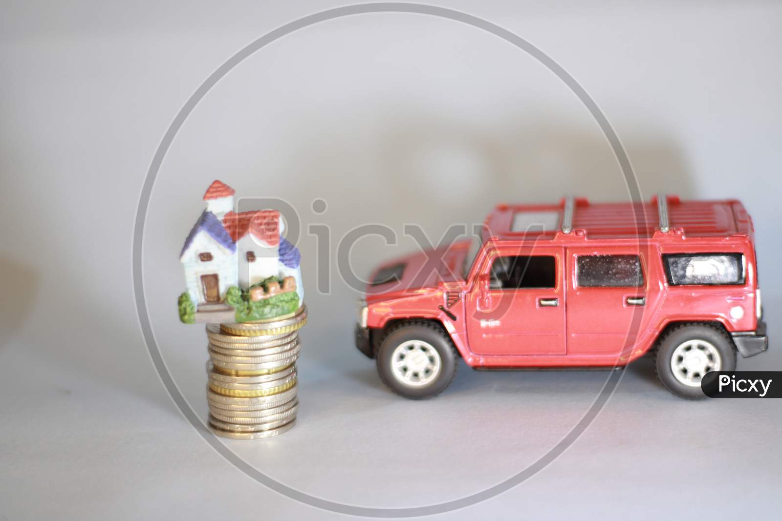 house model on money coins concept for savings, investment,  mortgage fund finance and home loan refinance. Real estate or property development. Bank loan or finance for home, Car loan financing.