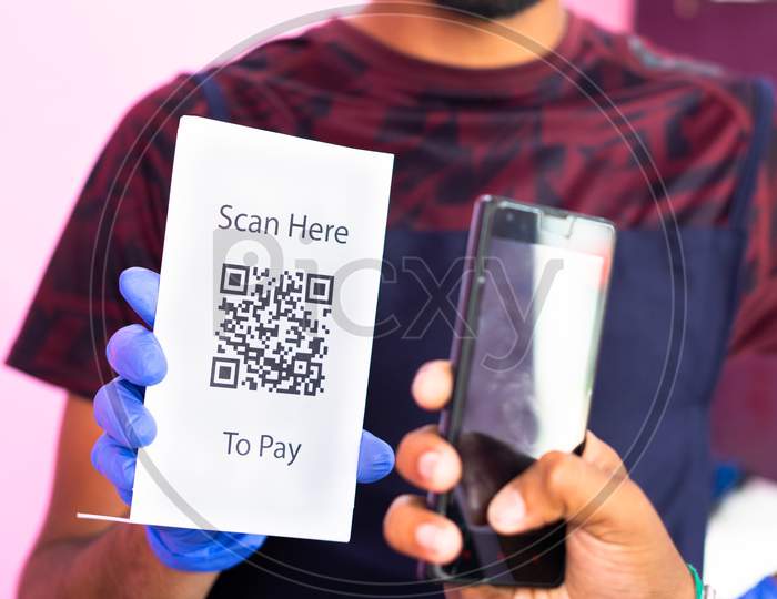 Unrecognizable Close Up Shot Of Customer Making Payment Using Qr Code In Smartphone To Barber - Concept Of E Payment Or Digital Pay, Cashless Technology, Recommending E Pay