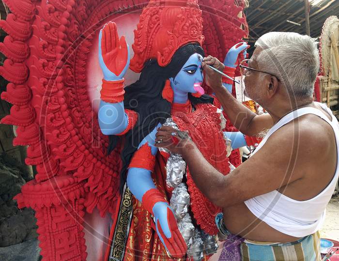 Goddess Kali during preparations in Kolkata. Clay idol of Goddess Kali, under preparation for Bengal's Kali Puja festival at Kumartuli Kolkata, India 18th October 2021