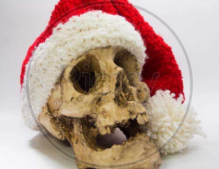 Human Skull With Elf Cap Isolated On Black Background