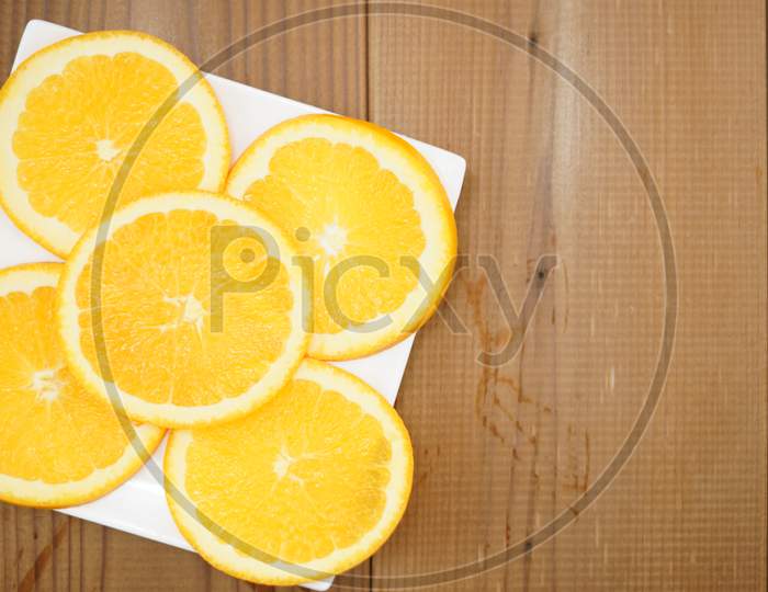 Image Of Orange Placed On A Plate