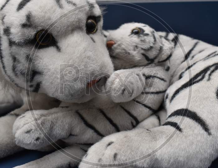 Closeup Of White Bengal Tiger Toy With Cub