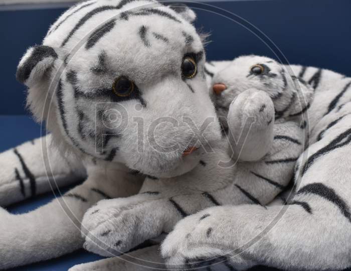 Closeup Of White Bengal Tiger Toy With Her Cub