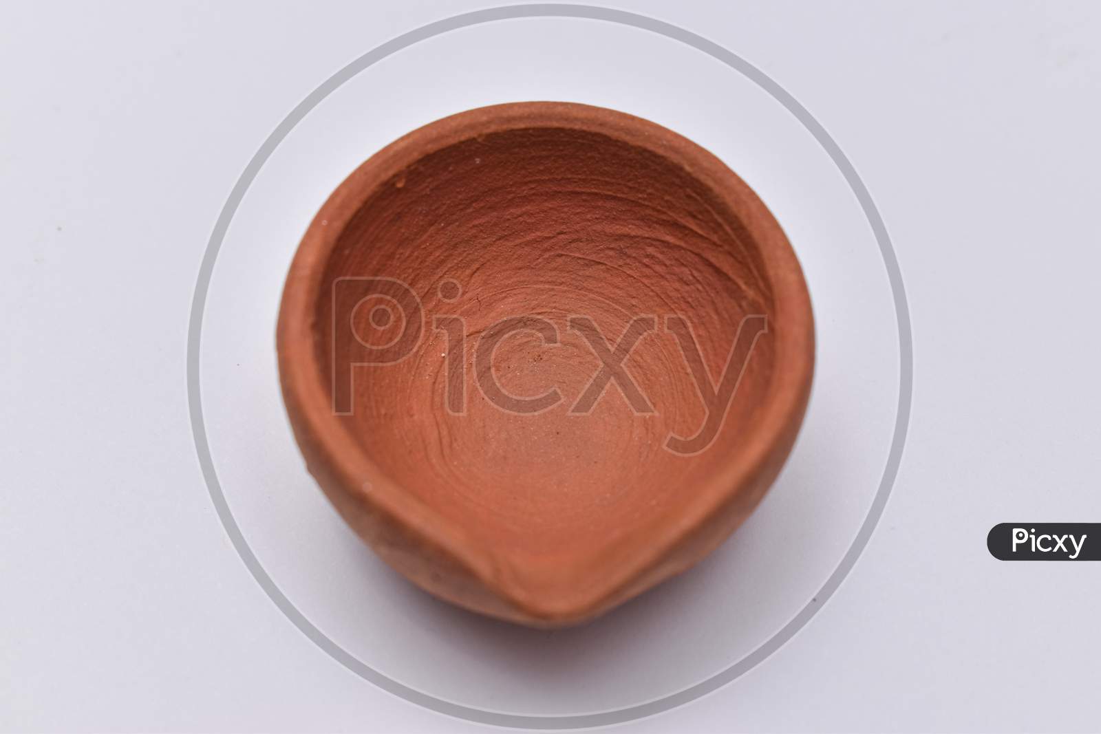 Indian Clay Oil Lamp Or Diya Used For Diwali And Festival Celebration Isolated With White Background
