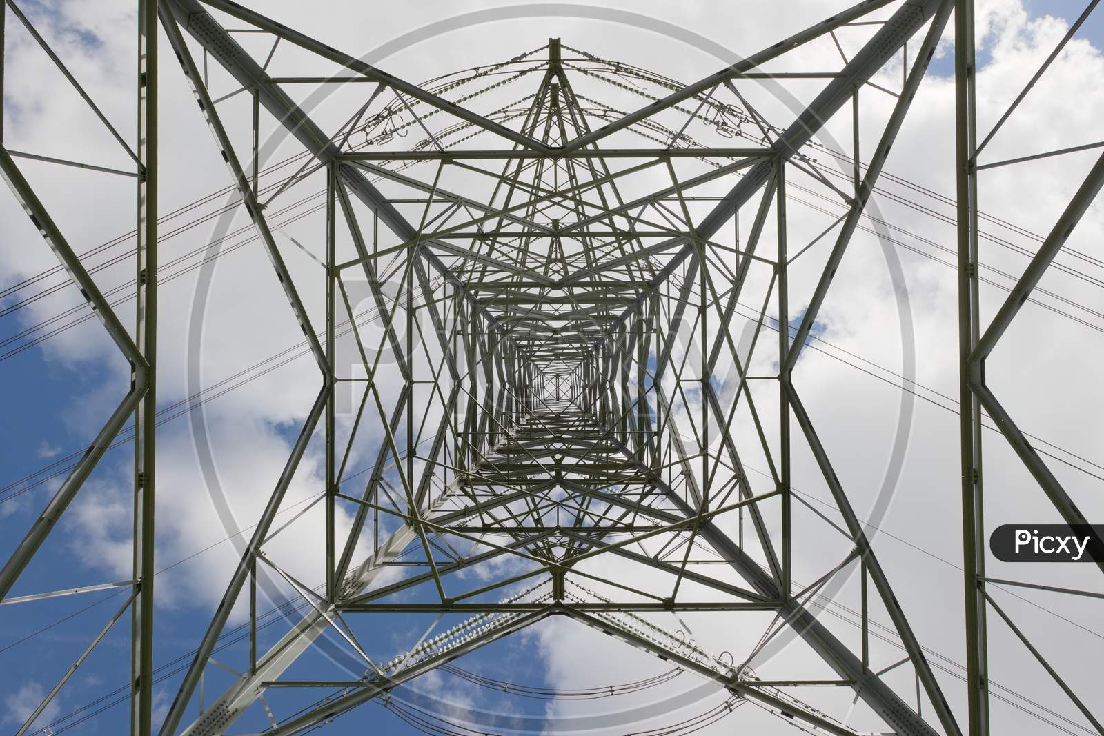 Image of Overhead Power Lines Turn On A Tall Pylon, Part Of The ...