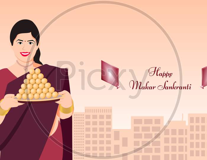 Indian Woman With Thali Of Laddoo Sweet On Building Silhouette Background With Text Happy Makar Sankranti.