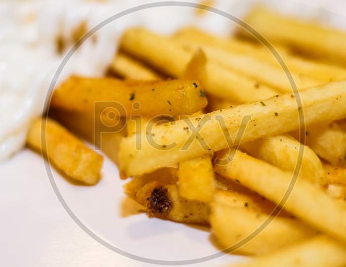 French Fries With Mayonnaise In A Plate, Close Up.