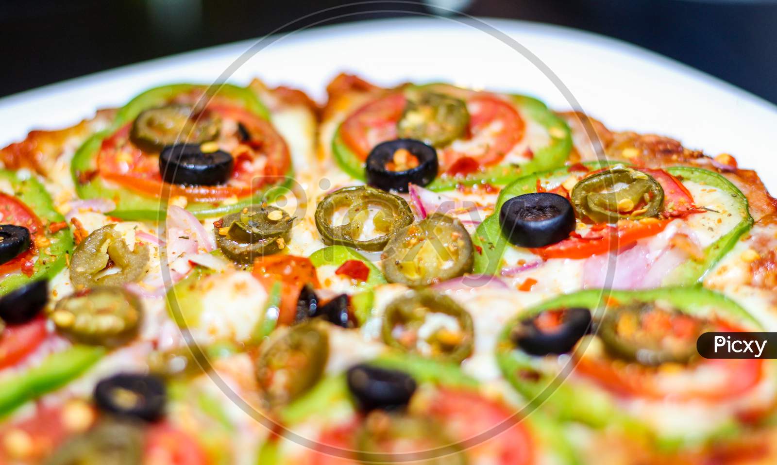 Fresh Homemade Pizza With Vegetables, Tomato, Onion And Olives Isolated On White Plate.