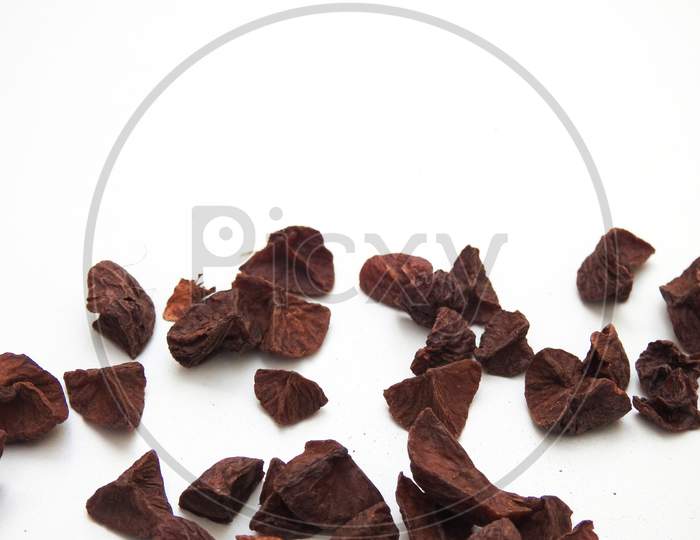Pattern Background Of A Indian Betelnut Slices Isolated On A White Background