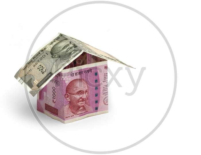 Indian Real Estate Business Concept Showing 3D Model Home Made Using Paper Currency Notes, Isolated On White Background.