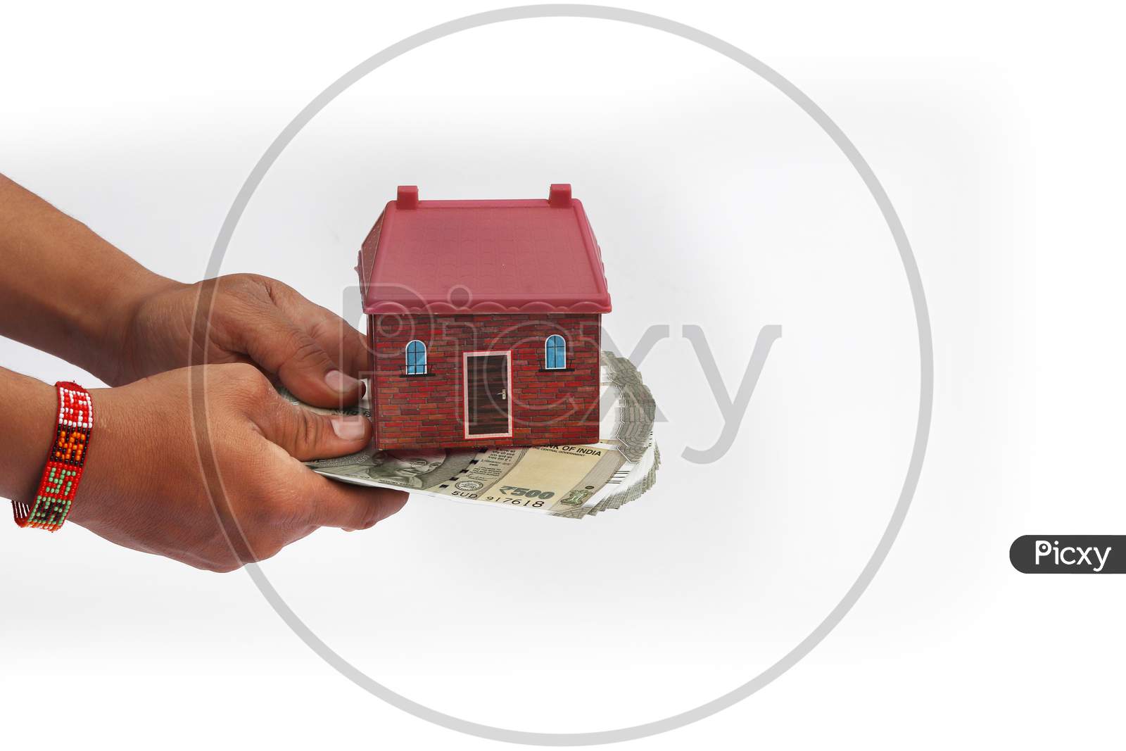 Close Up Of Hands Giving House Model With Indian Currency Notes. Concept Of Home, Real Estate And Deal Isolated On White Background