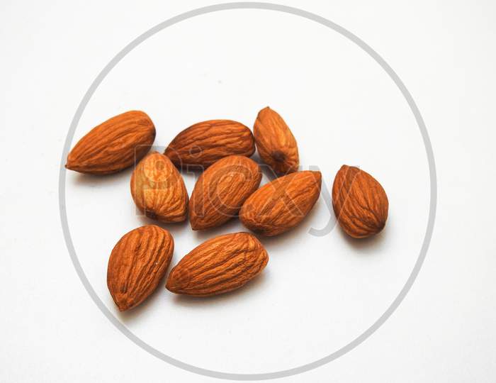 Heap Of A Many Almonds Seeds Isolate On A White Background
