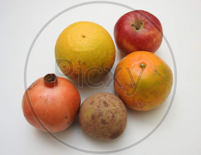 Pile And Heap Of A Indian Mixed Fruits Isolated On White Background