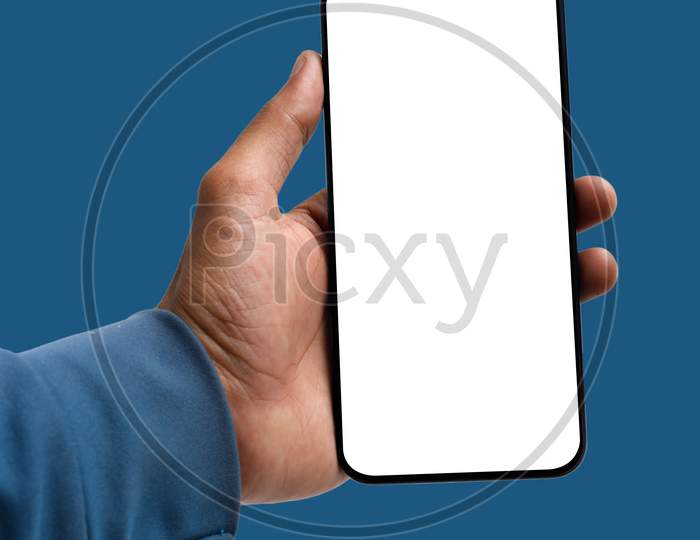Holding Smartphone In Hand On Blue Background