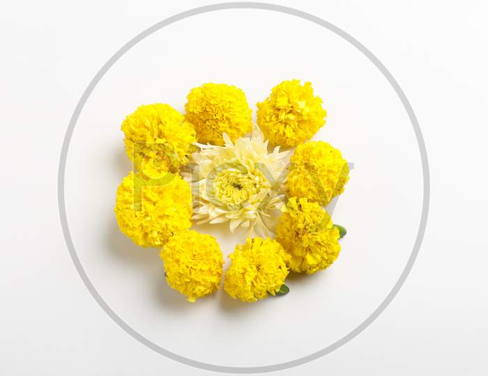 Marigold Flower Rangoli Design With Green Leaf For Traditional Festival.