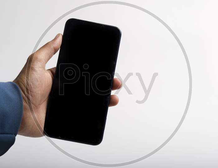 Holding Smartphone In Hand On White Background