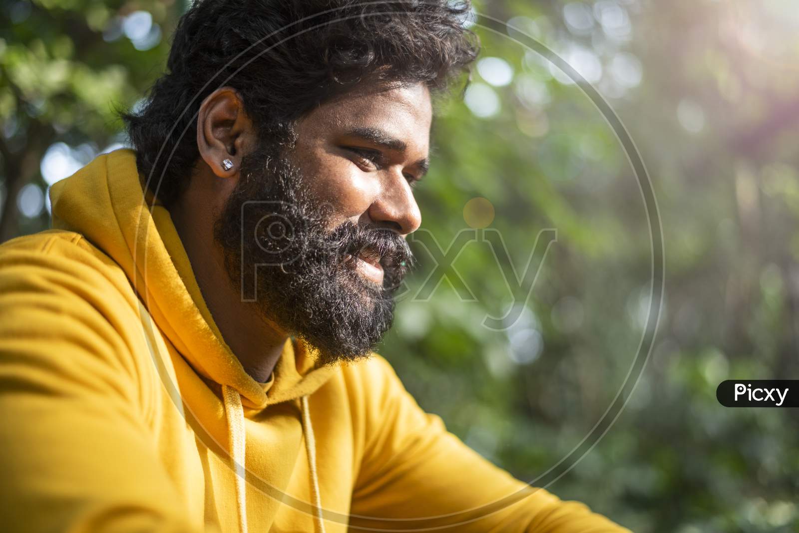 The happy smiling face of a male model, Close up photograph of an Indian male model