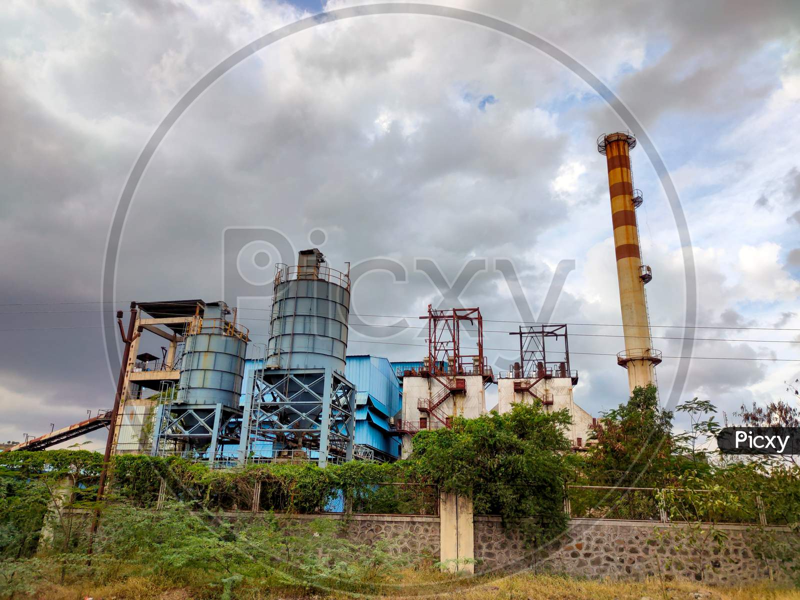 Metallurgical plant with pipes, environmental pollution. Industrial landscape
