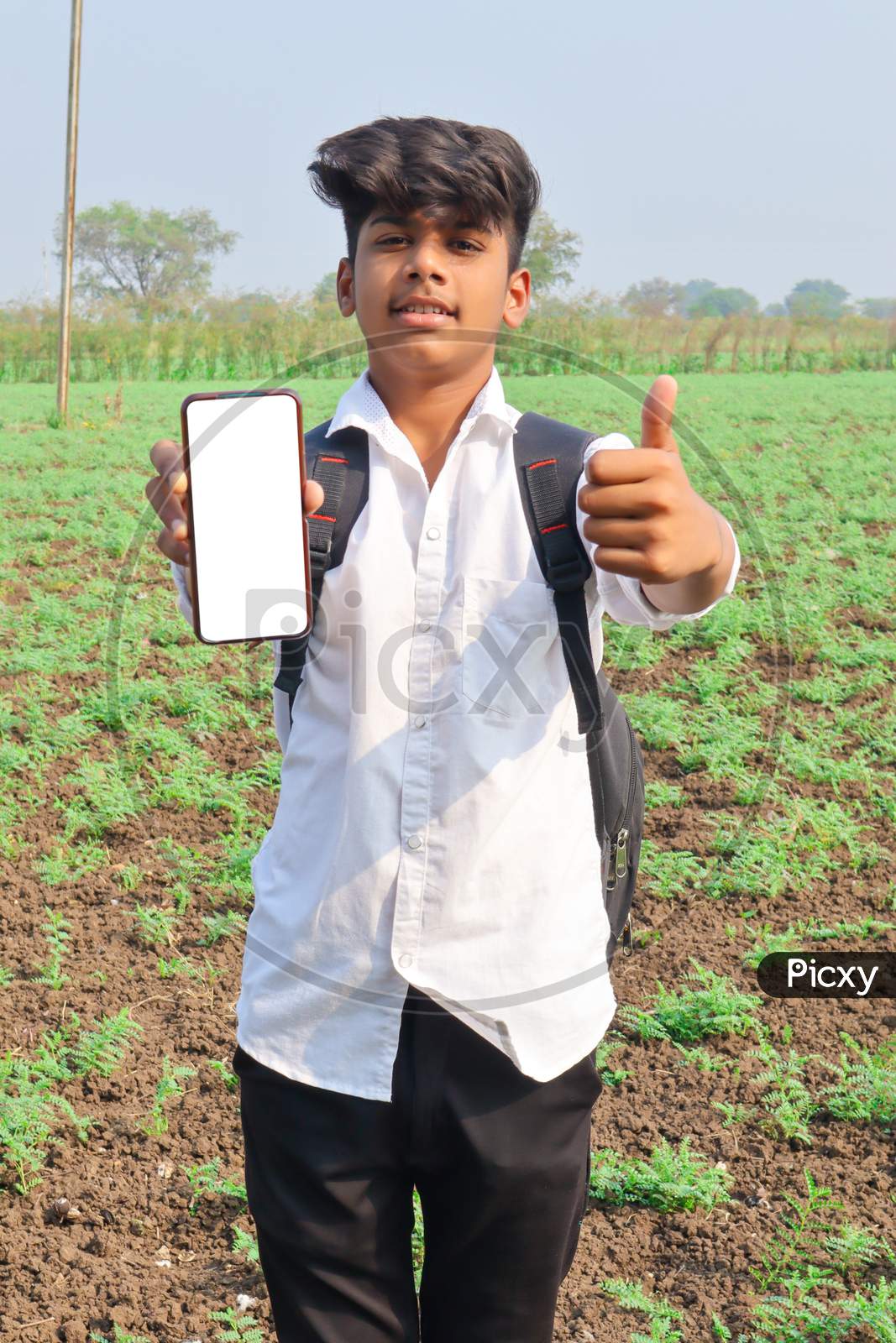 Indian Child Showing Smartphone Screen At Agriculture Field.