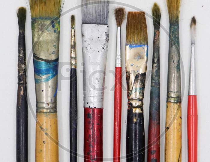 a group of wooden artists paint brushes