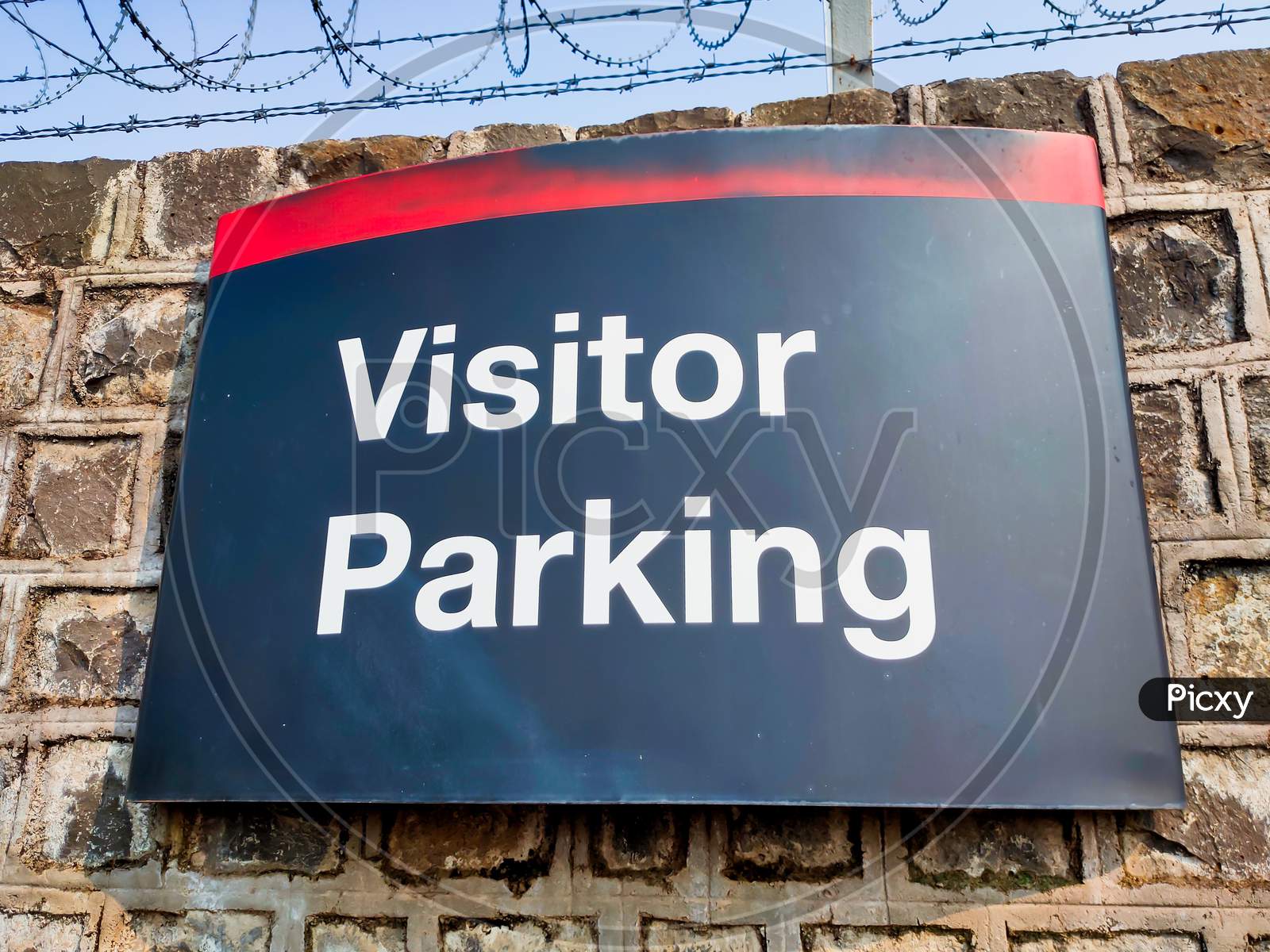 Visitor Parking sign in a parking lot.