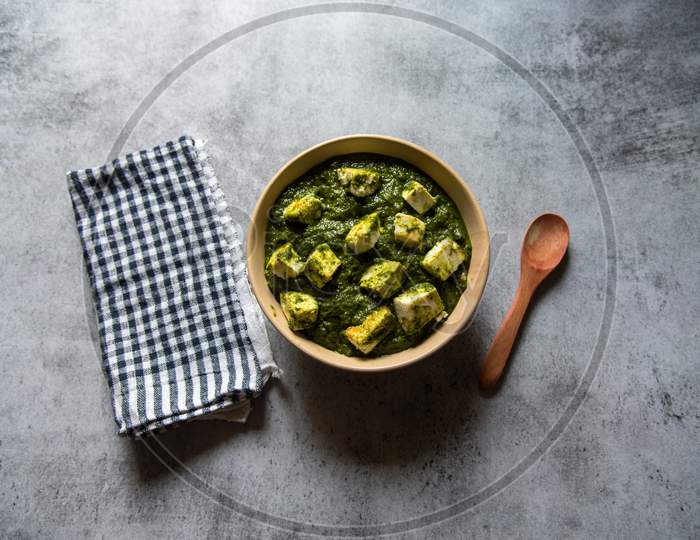 Palak paneer or cottage cheese cubes in spinach curry