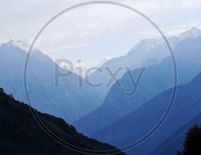 vast stretch of Foggy himalayan Valleyand mountain range