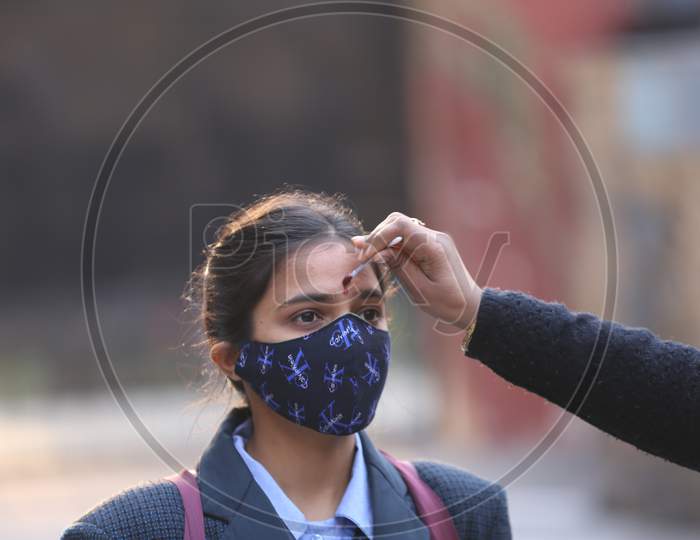 School staff welcome to the students to attend their school in Jammu on Monday. All educational institutions reopened in summer zone Jammu after remaining closed for over 10 months following outbreak of Coronavirus pandemic.1, FEB,2021.