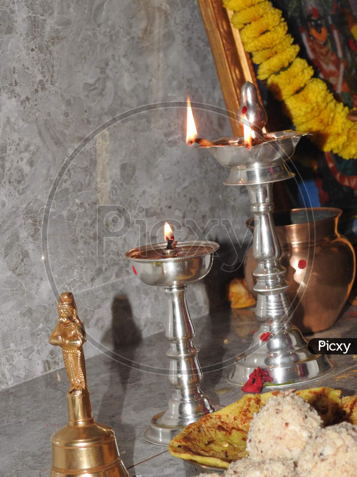 Traditional South Indian Brass Oil Lamp Or Nilavilakku. During Events Like Housewarming, Marriage Etc., The Nilavilakku Is Lighted Before Starting The Rituals