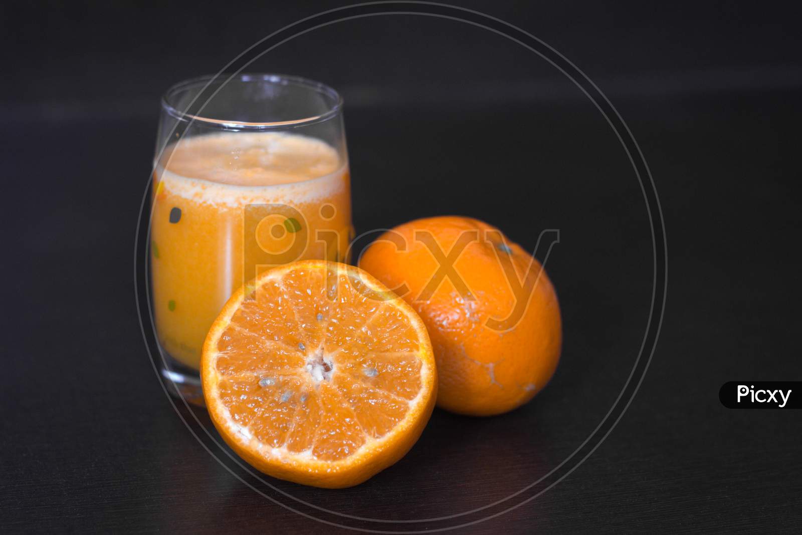 Glass of orange juice and fresh fruits