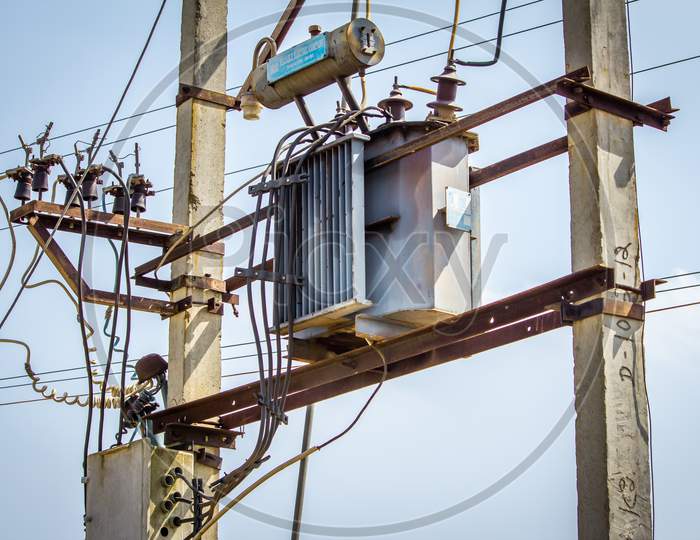 View Of Overhead Electrical Transformer In Rural Area, India