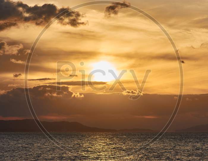 Beautiful Scenery Of The Sunset Sky Reflecting On A Peaceful Sea