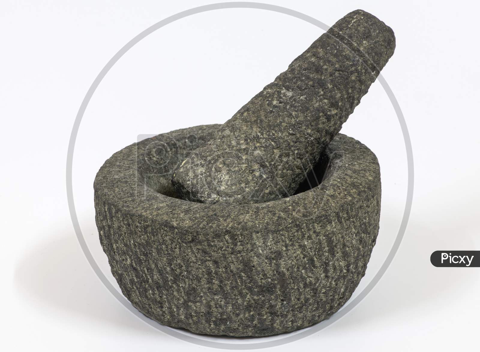 Stone Mortar And Pestle On A White Background