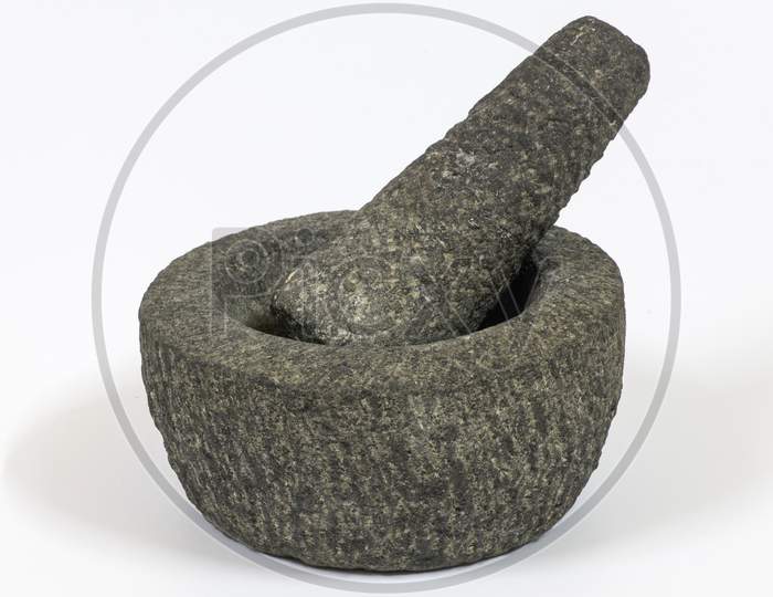 Stone Mortar And Pestle On A White Background