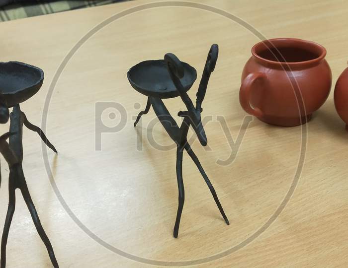 A candle holder on shape of horse which is made by iron
