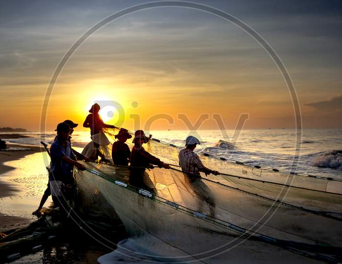 Scenery of local fishermen pulling fish nets