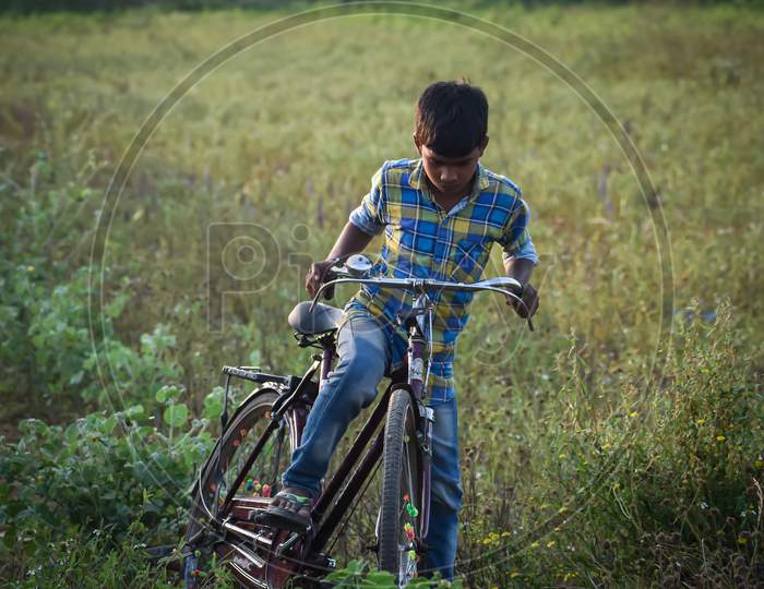 Picture of a boy riding a bicycle