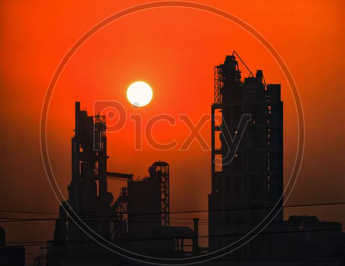 Picture of a factory in sunset
