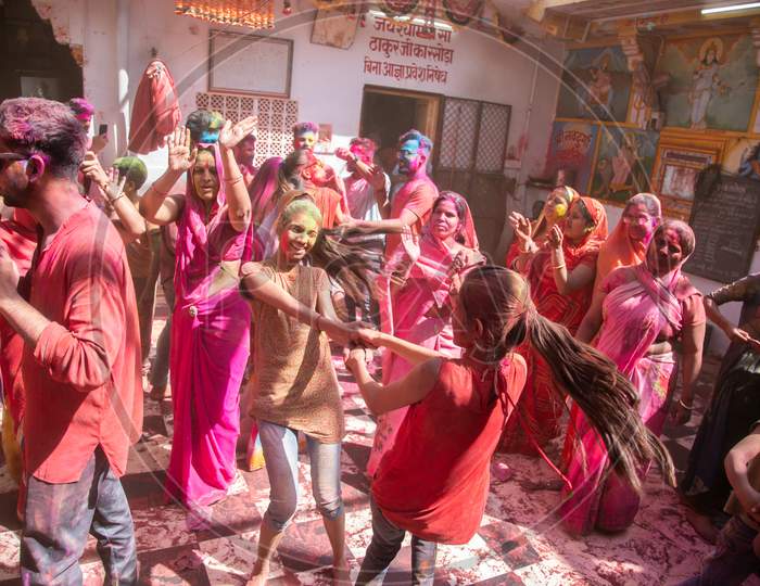 Jodhpur, Rajastha, India - March 20, 2020: Indian Women Celebrating Holi Festival With Colored Powder, Dancing And Enjoying.