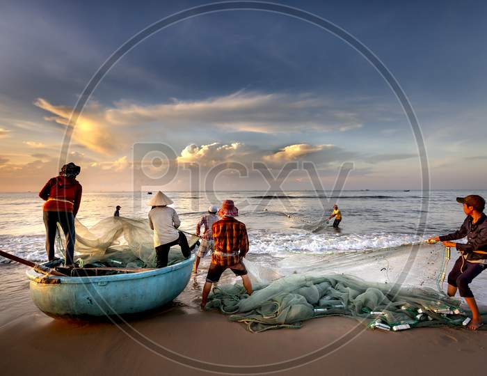 Scenery of local fishermen pulling fish nets