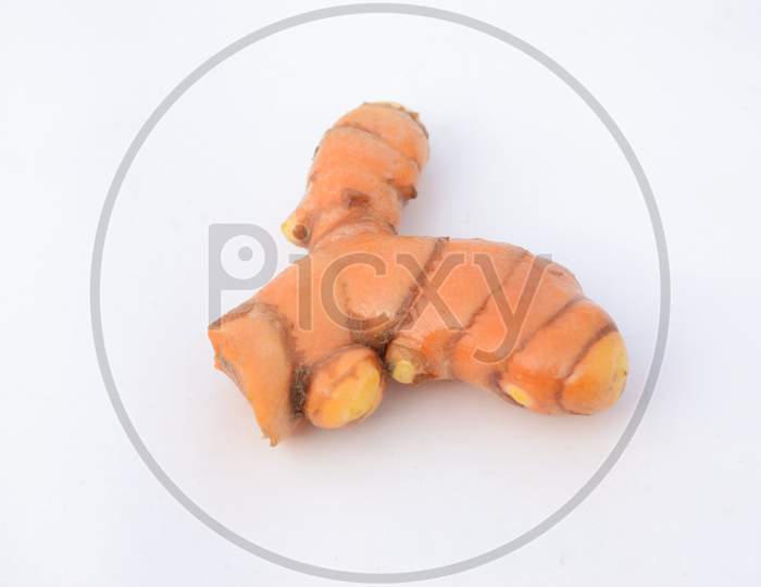 The Ripe Orange Color Turmeric Isolated On White Background.
