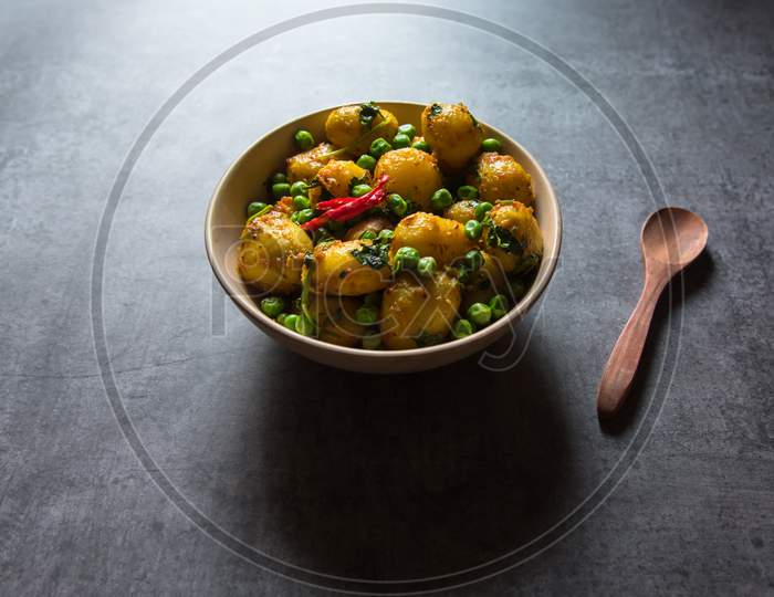 Indian dum aloo or potatoes cooked in slow fire in a bowl.
