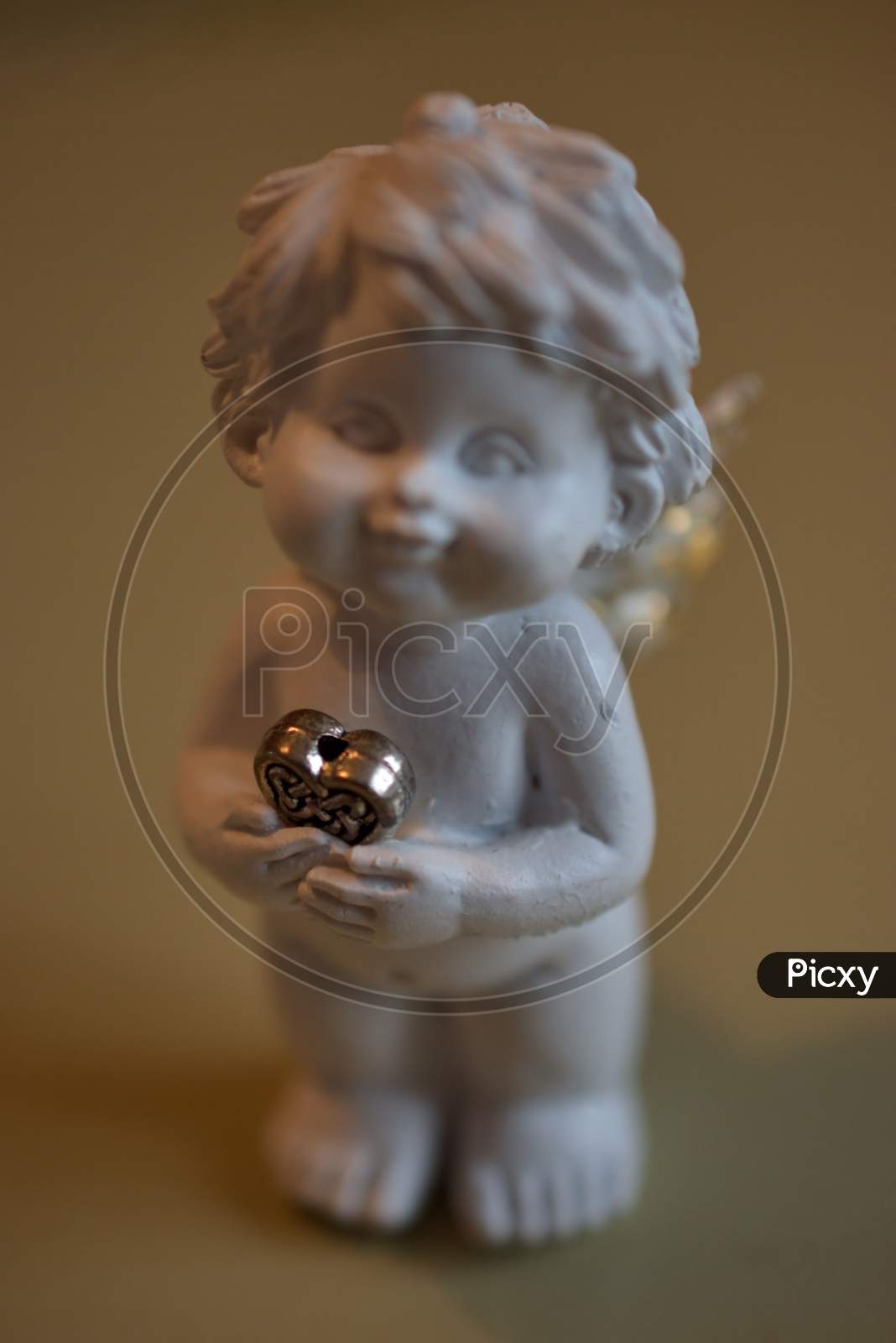 Little Child Is Holding A Golden Heart For Christmas Decoration 21.12.2020