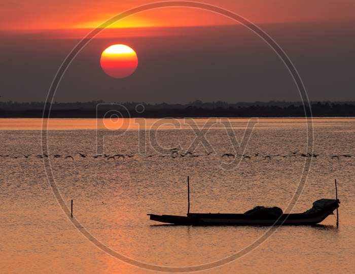 Scenic View Of The Fisherman Boat In Odiyur Lake Along The East Coast Road With Sunset Sky In Background, Tamil Nadu, India. Selective Focus On Boat